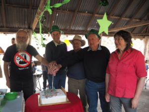 Some of the original Cactus Warriors cutting the cake
